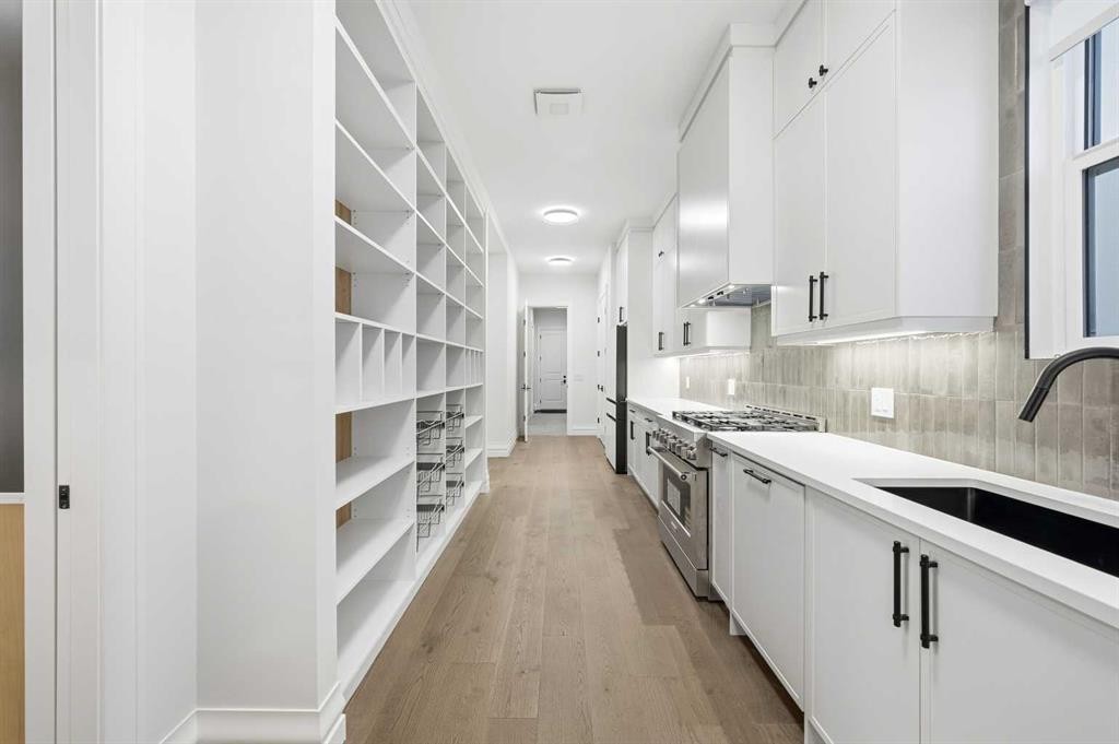 126 Sunstone Way, Balzac, AB - Indoor Photo Showing Kitchen With Upgraded Kitchen