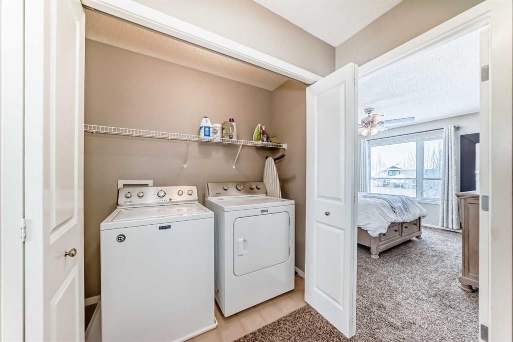 63 Chapalina Square Se, Calgary, AB - Indoor Photo Showing Laundry Room