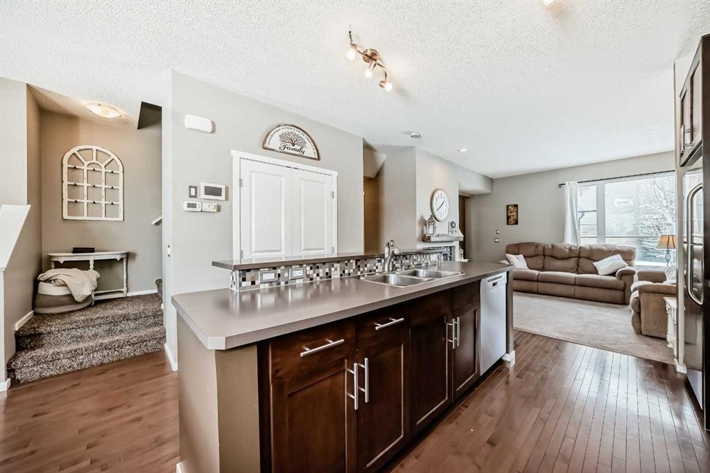 63 Chapalina Square Se, Calgary, AB - Indoor Photo Showing Kitchen With Double Sink
