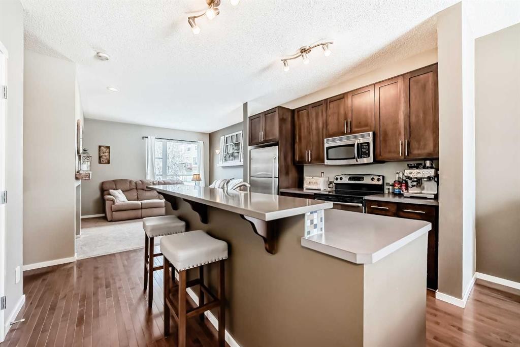 63 Chapalina Square Se, Calgary, AB - Indoor Photo Showing Kitchen With Stainless Steel Kitchen With Upgraded Kitchen