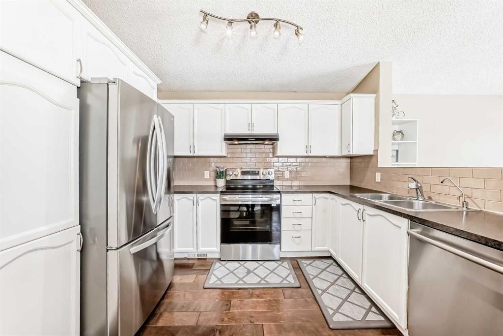 67 Bridleglen Manor Sw, Calgary, AB - Indoor Photo Showing Kitchen With Stainless Steel Kitchen With Double Sink