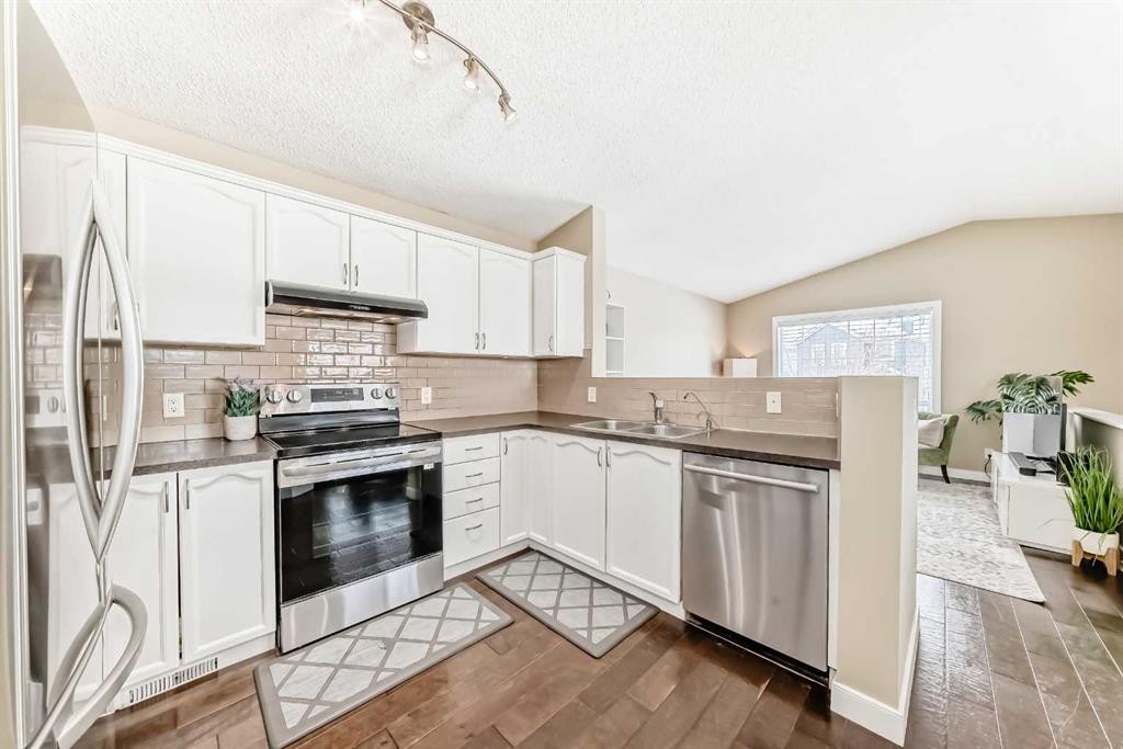67 Bridleglen Manor Sw, Calgary, AB - Indoor Photo Showing Kitchen With Stainless Steel Kitchen With Double Sink