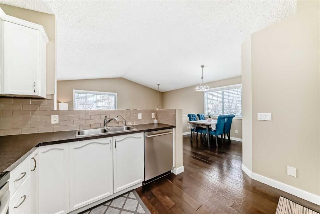 67 Bridleglen Manor Sw, Calgary, AB - Indoor Photo Showing Kitchen With Double Sink