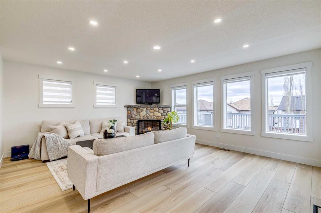 447 Tuscany Ridge Heights Nw, Calgary, AB - Indoor Photo Showing Living Room With Fireplace