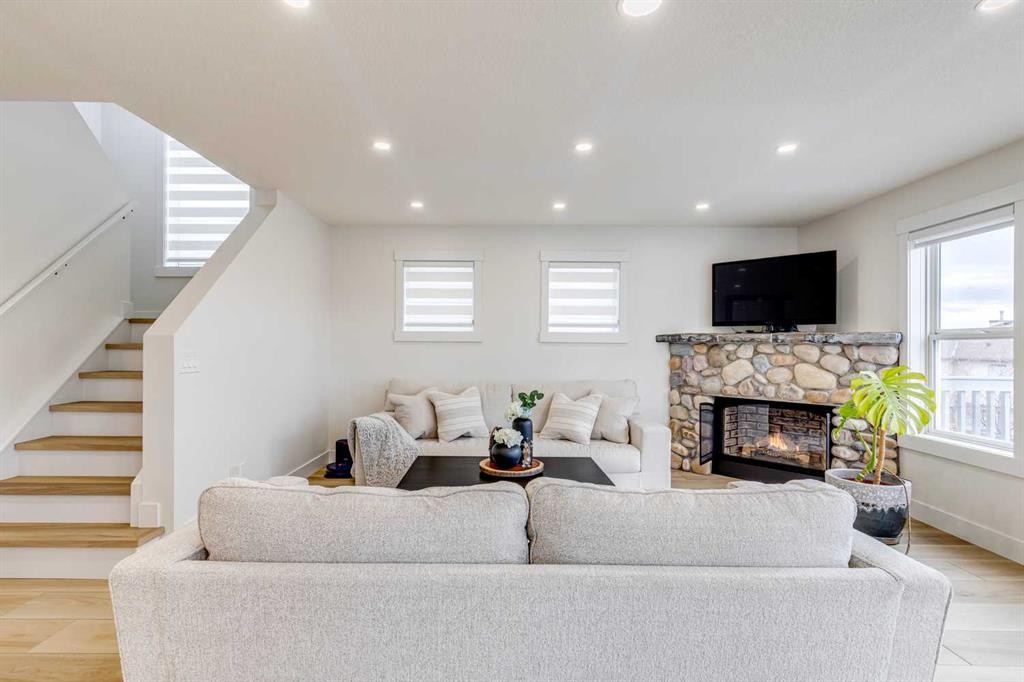 447 Tuscany Ridge Heights Nw, Calgary, AB - Indoor Photo Showing Living Room With Fireplace