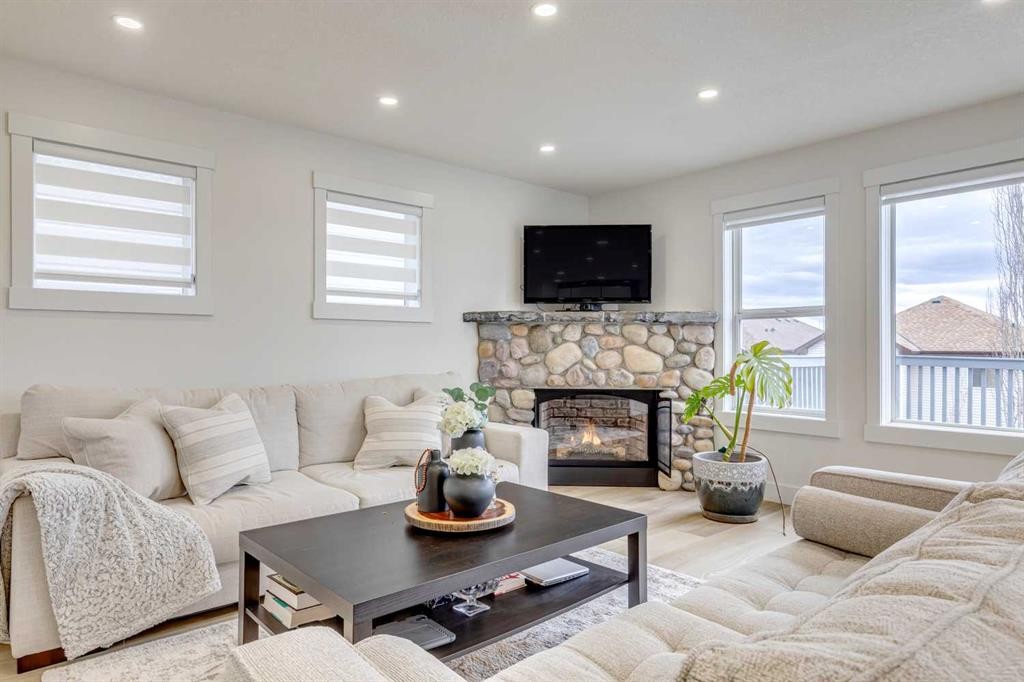 447 Tuscany Ridge Heights Nw, Calgary, AB - Indoor Photo Showing Living Room With Fireplace