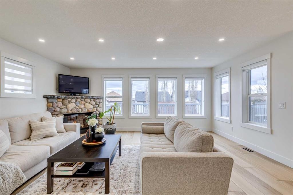 447 Tuscany Ridge Heights Nw, Calgary, AB - Indoor Photo Showing Living Room With Fireplace