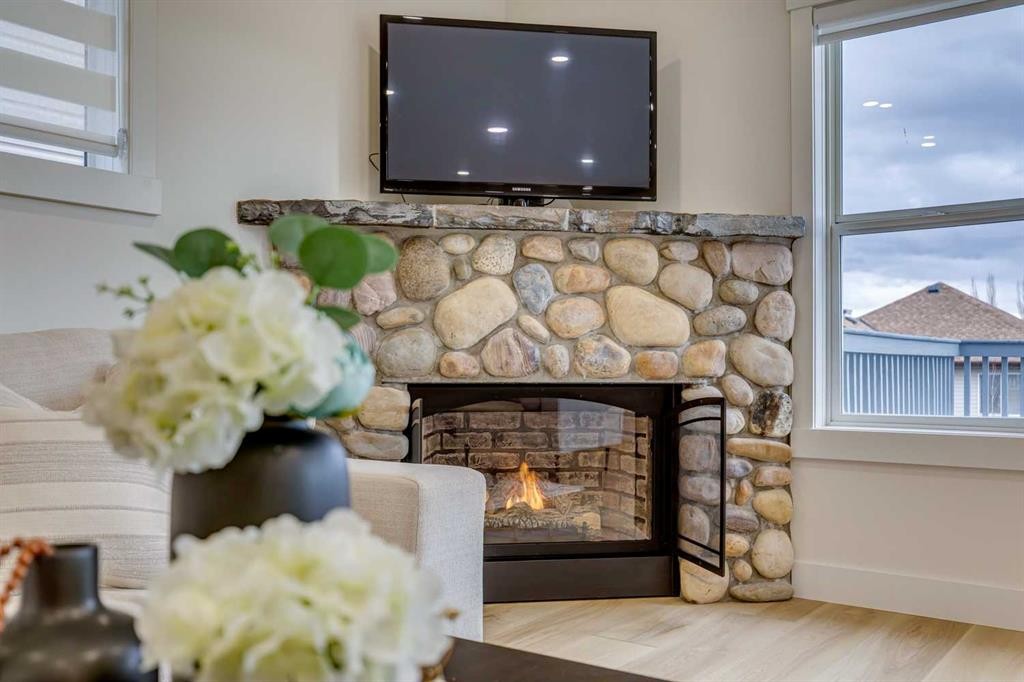 447 Tuscany Ridge Heights Nw, Calgary, AB - Indoor Photo Showing Living Room With Fireplace