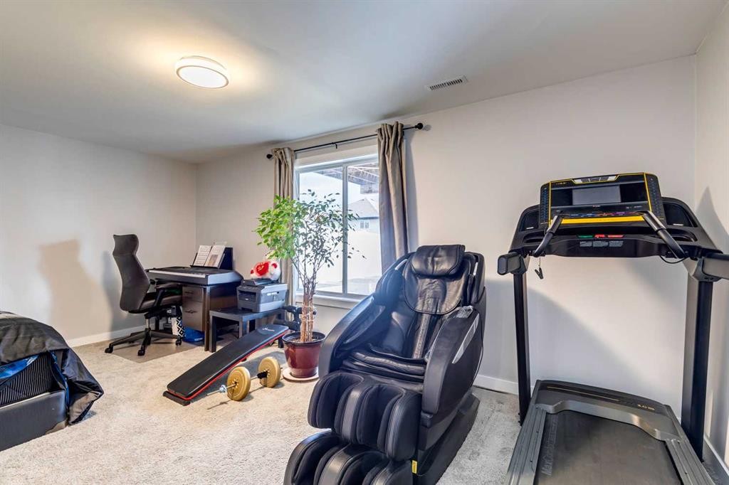 447 Tuscany Ridge Heights Nw, Calgary, AB - Indoor Photo Showing Gym Room