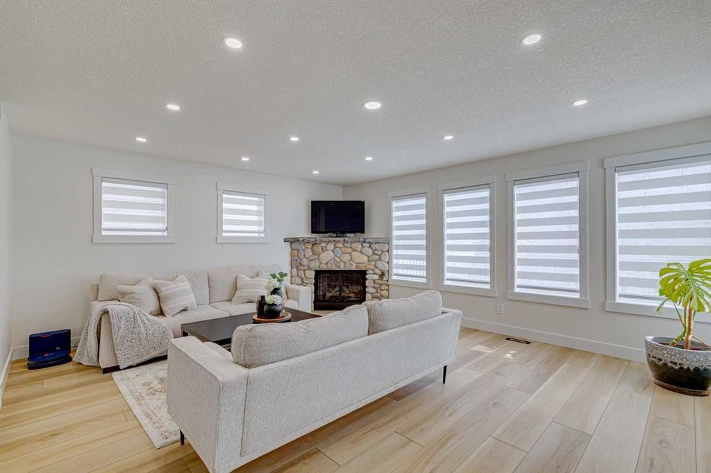 447 Tuscany Ridge Heights Nw, Calgary, AB - Indoor Photo Showing Living Room With Fireplace