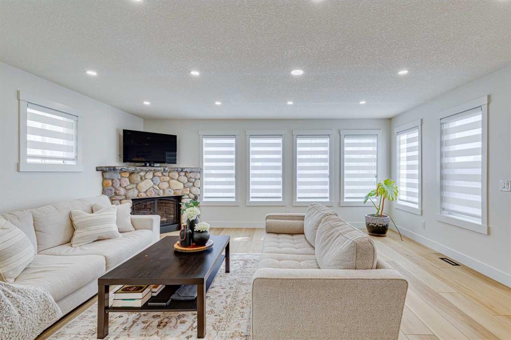 447 Tuscany Ridge Heights Nw, Calgary, AB - Indoor Photo Showing Living Room With Fireplace