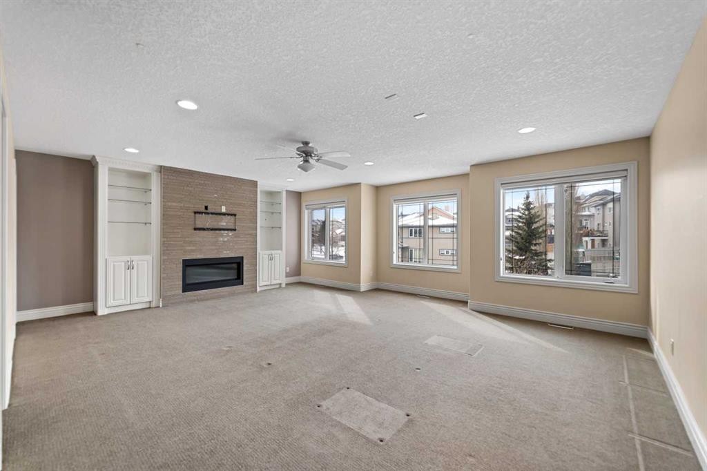 28 Panatella Manor Nw, Calgary, AB - Indoor With Fireplace