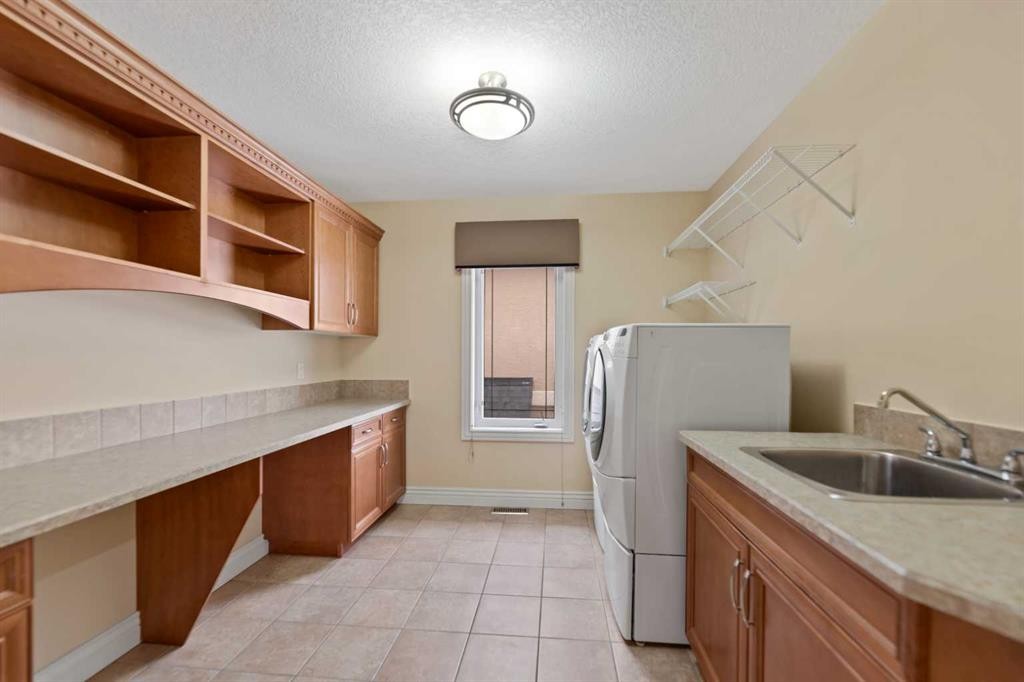 28 Panatella Manor Nw, Calgary, AB - Indoor Photo Showing Laundry Room