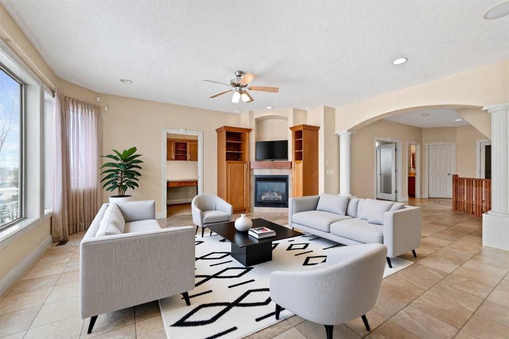 28 Panatella Manor Nw, Calgary, AB - Indoor Photo Showing Living Room With Fireplace