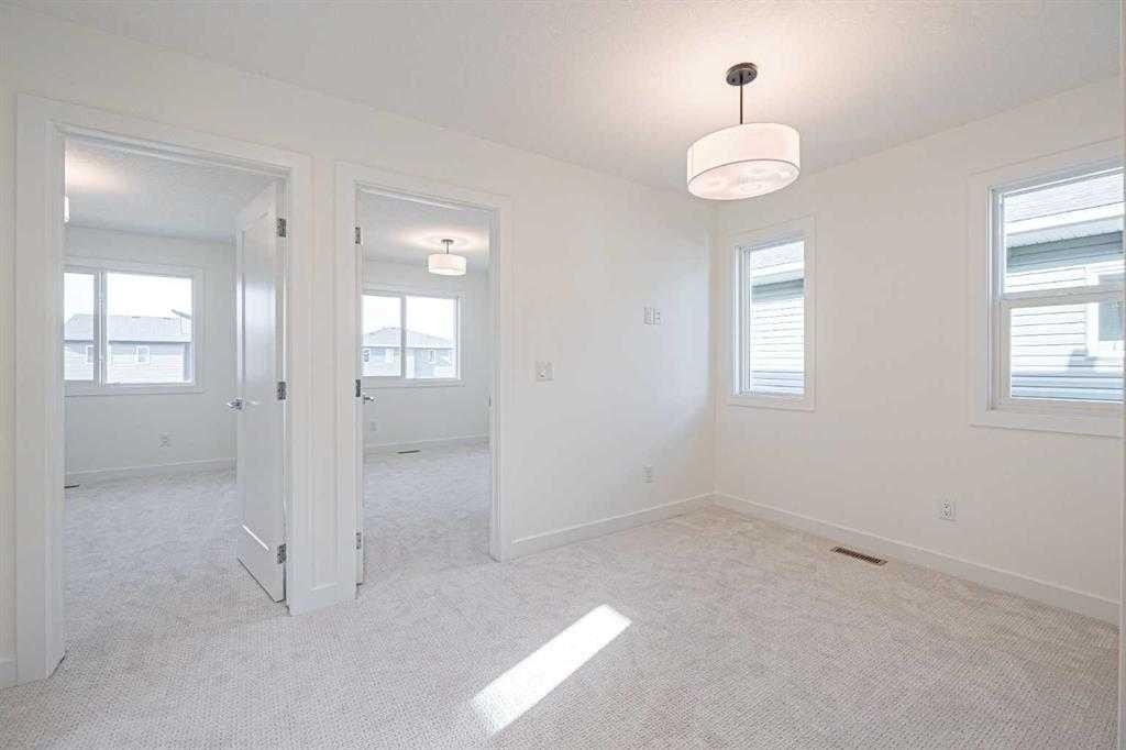 129 Dawson Wharf View, Chestermere, AB - Indoor Photo Showing Other Room