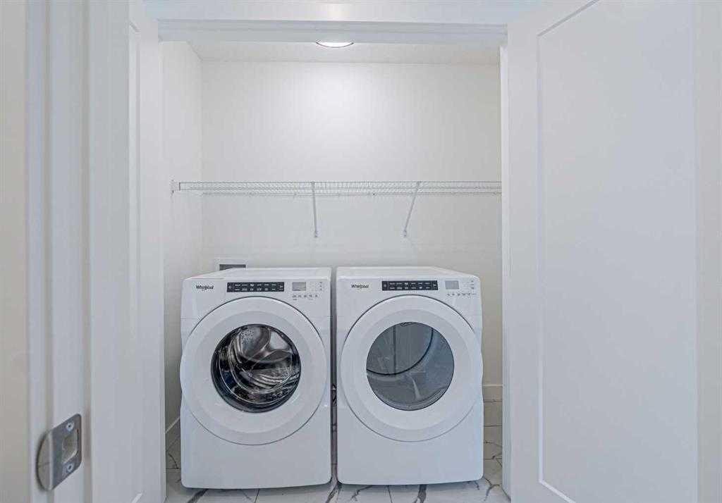 129 Dawson Wharf View, Chestermere, AB - Indoor Photo Showing Laundry Room