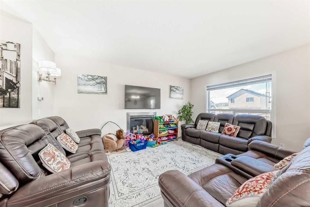 151 Covepark Green Ne, Calgary, AB - Indoor Photo Showing Living Room With Fireplace