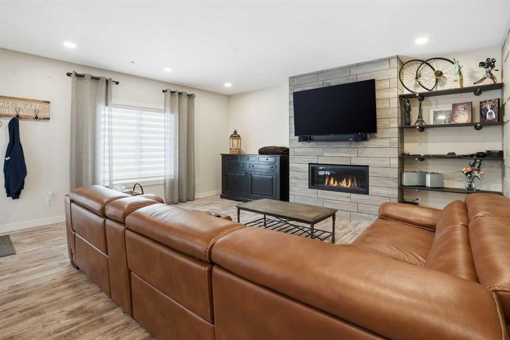 111 Crestridge View Sw, Calgary, AB - Indoor Photo Showing Living Room With Fireplace
