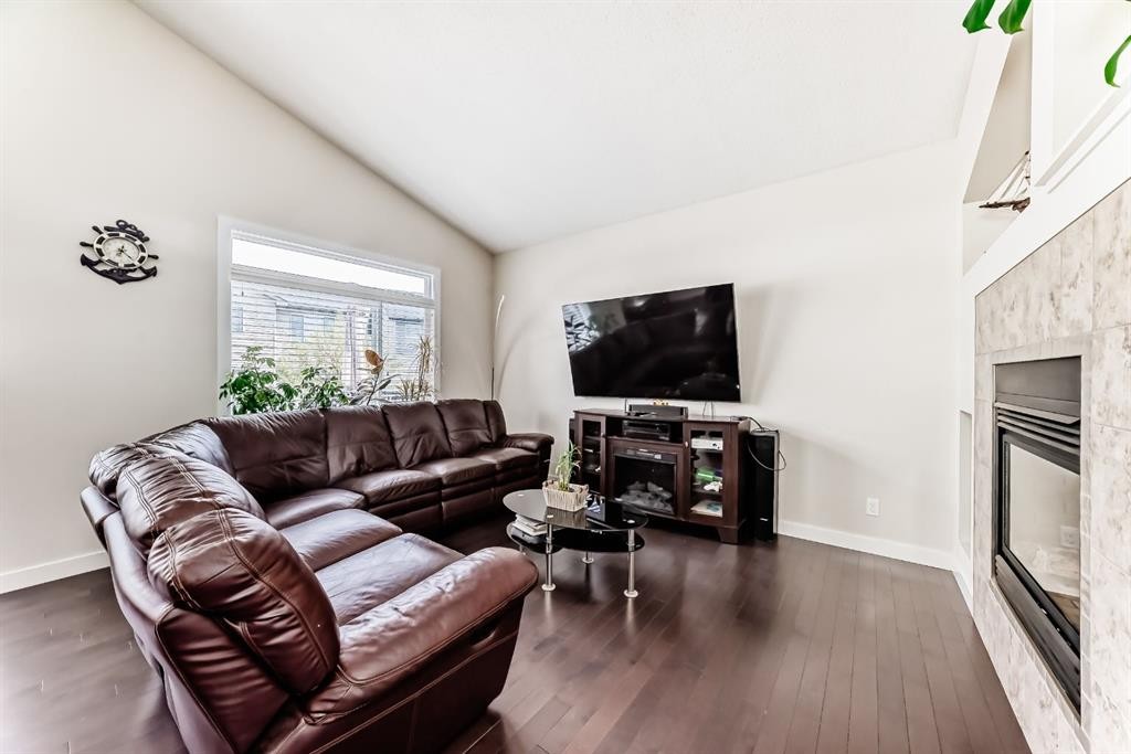 612 Montgomery Close Se, High River, AB - Indoor Photo Showing Living Room With Fireplace