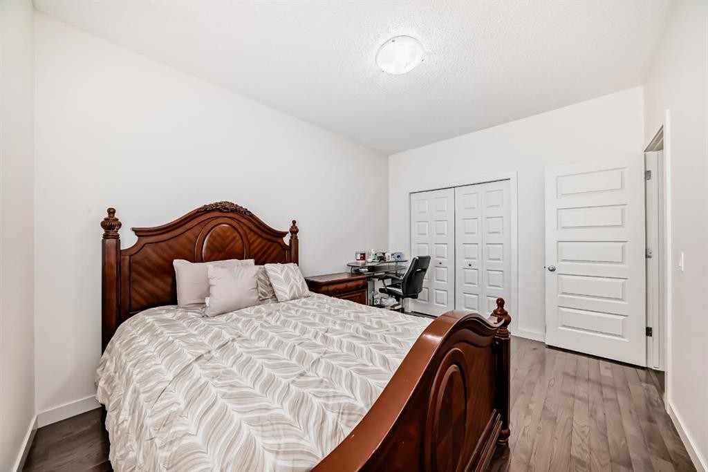 612 Montgomery Close Se, High River, AB - Indoor Photo Showing Bedroom
