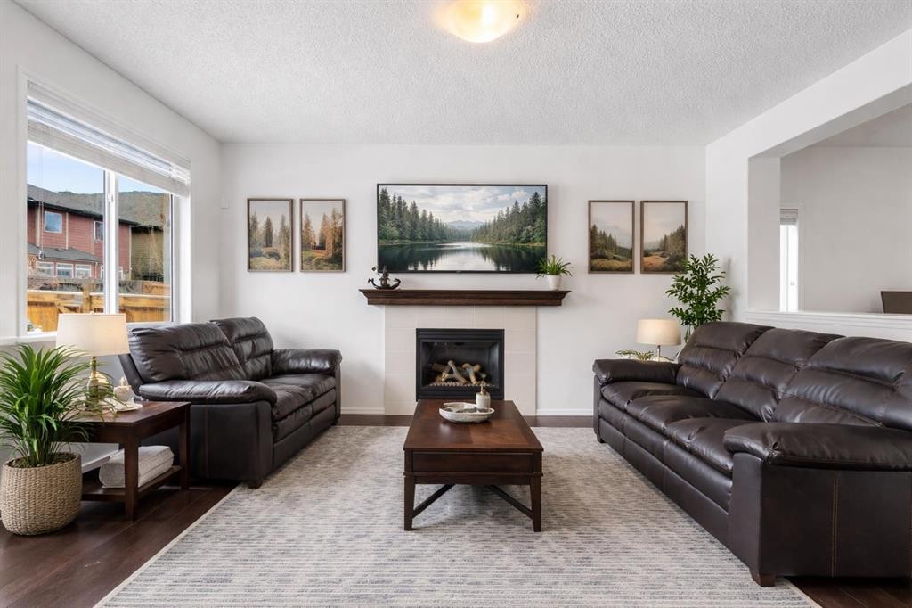 182 Auburn Sound Close Se, Calgary, AB - Indoor Photo Showing Living Room With Fireplace
