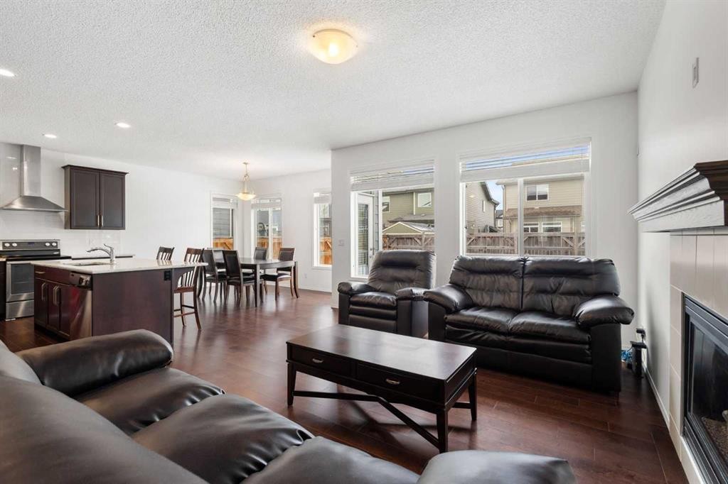 182 Auburn Sound Close Se, Calgary, AB - Indoor Photo Showing Living Room With Fireplace