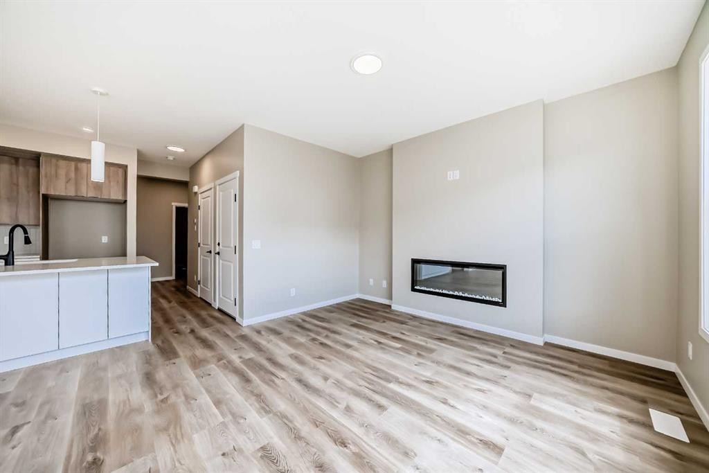 1085 Sawgrass Link Nw, Airdrie, AB - Indoor With Fireplace