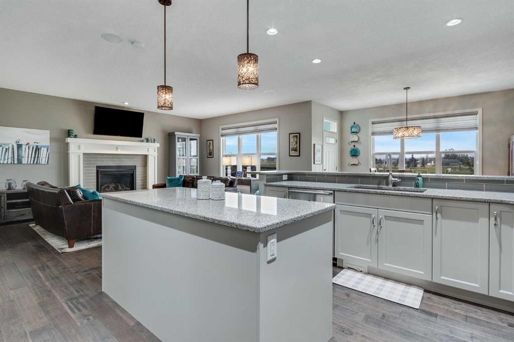 55 Sage Bluff Green Nw, Calgary, AB - Indoor Photo Showing Kitchen With Fireplace