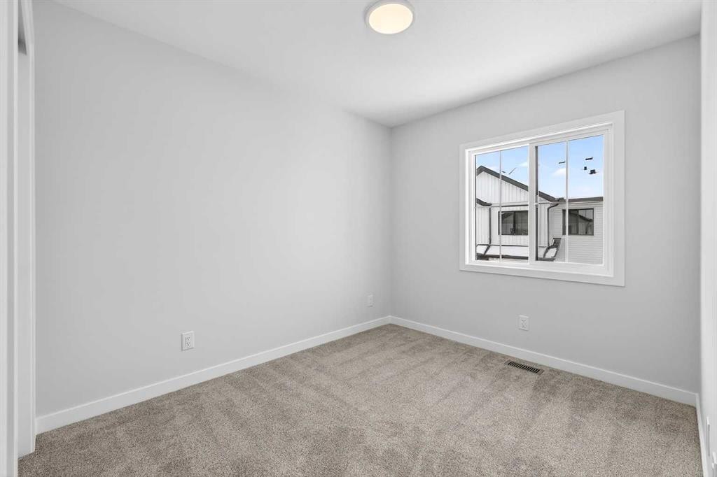 121-1750 Rangeview Drive Se, Calgary, AB - Indoor Photo Showing Other Room