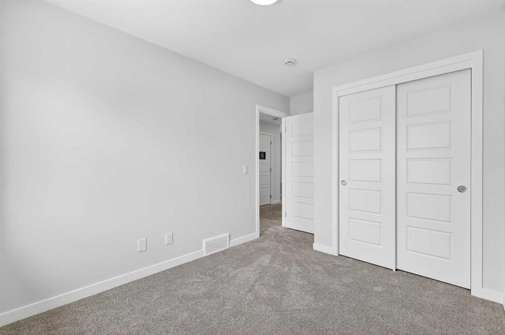 121-1750 Rangeview Drive Se, Calgary, AB - Indoor Photo Showing Other Room