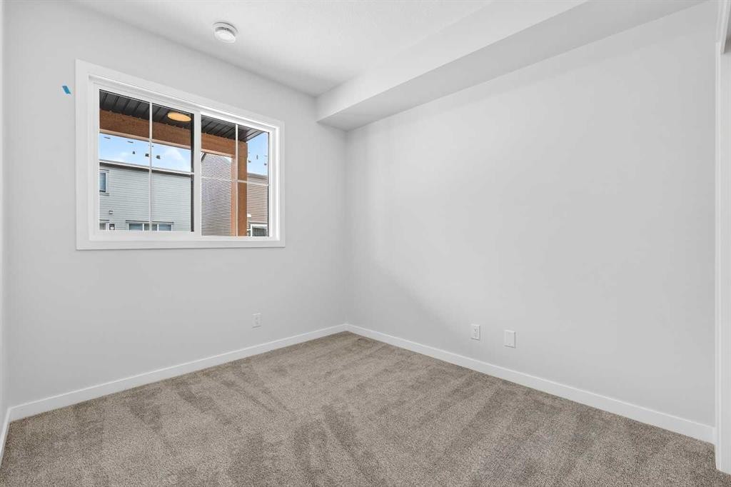 121-1750 Rangeview Drive Se, Calgary, AB - Indoor Photo Showing Other Room