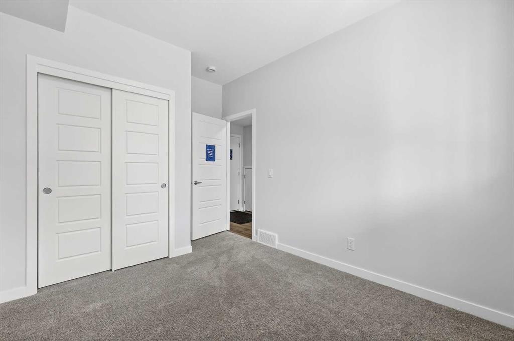 121-1750 Rangeview Drive Se, Calgary, AB - Indoor Photo Showing Other Room