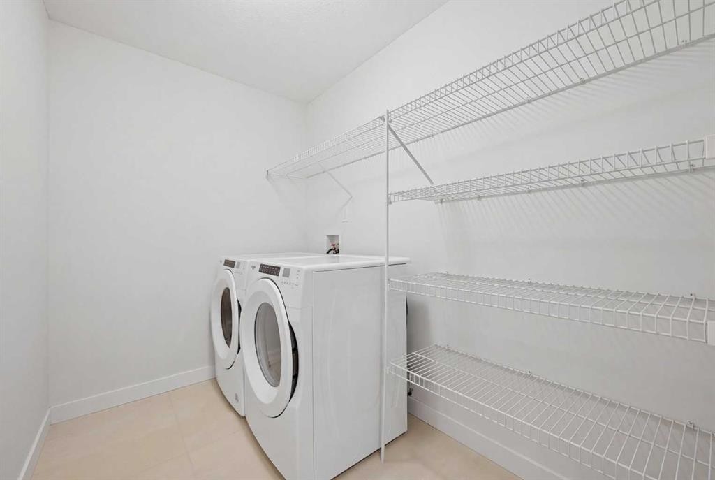 1448 Bayview Point Sw, Airdrie, AB - Indoor Photo Showing Laundry Room