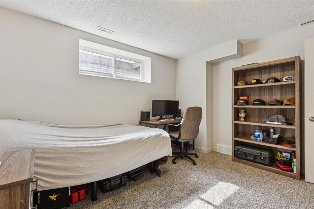 298 River Heights Crescent, Cochrane, AB - Indoor Photo Showing Bedroom