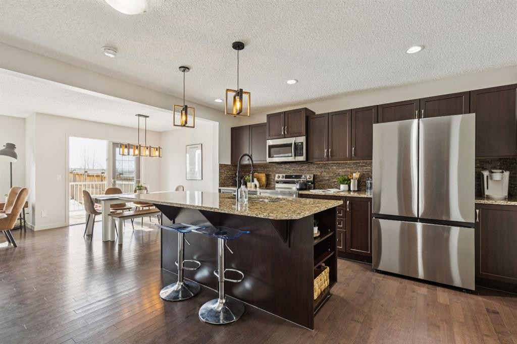 298 River Heights Crescent, Cochrane, AB - Indoor Photo Showing Kitchen With Stainless Steel Kitchen With Upgraded Kitchen