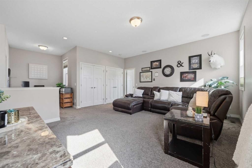 344 Sunset View, Cochrane, AB - Indoor Photo Showing Living Room