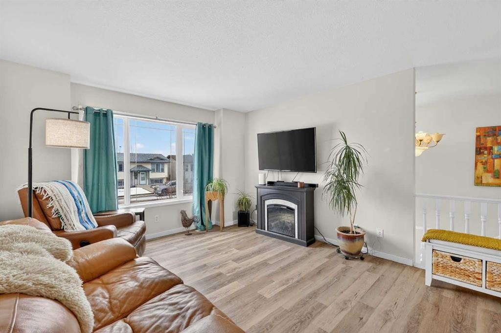 1175 Strathcona Road, Strathmore, AB - Indoor Photo Showing Living Room With Fireplace