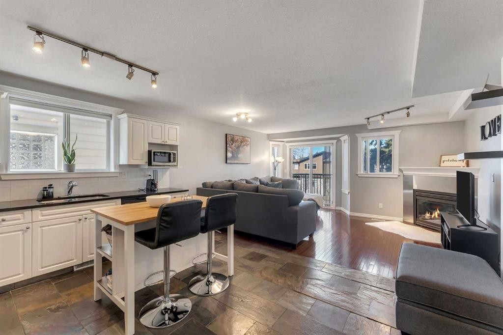 201-215 17 Avenue Ne, Calgary, AB - Indoor With Fireplace