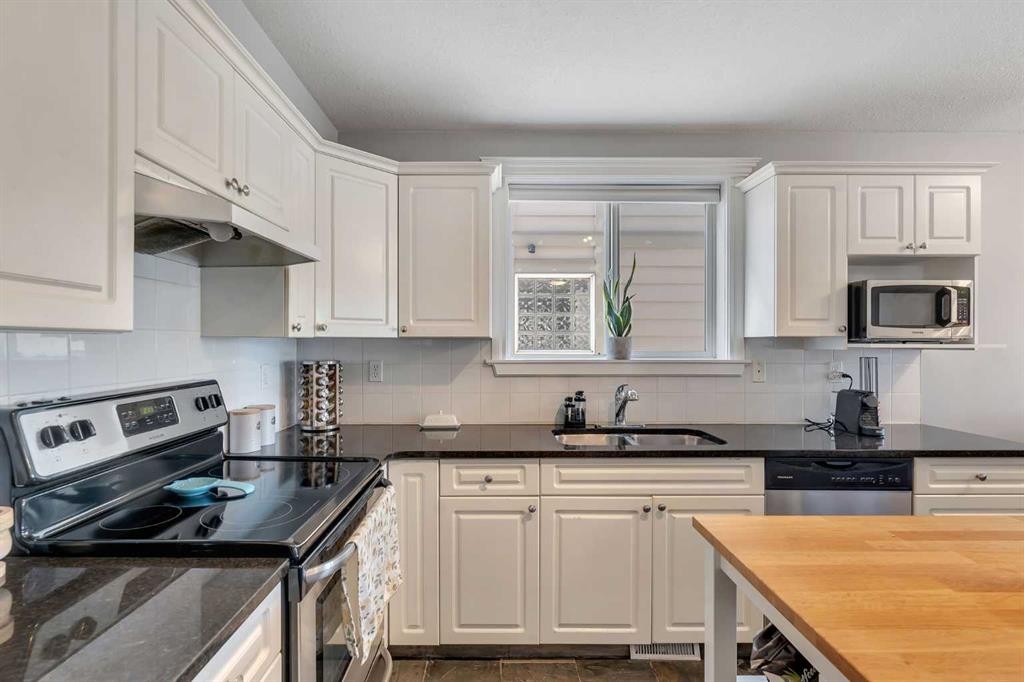 201-215 17 Avenue Ne, Calgary, AB - Indoor Photo Showing Kitchen With Double Sink