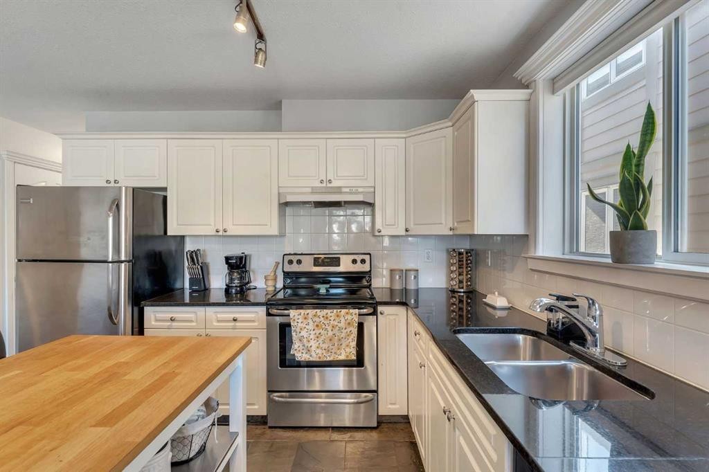 201-215 17 Avenue Ne, Calgary, AB - Indoor Photo Showing Kitchen With Double Sink