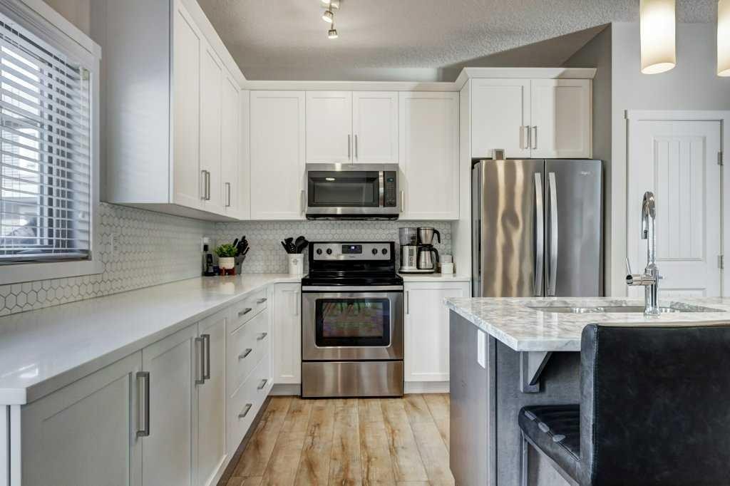 444 Legacy Point Se, Calgary, AB - Indoor Photo Showing Kitchen With Double Sink With Upgraded Kitchen