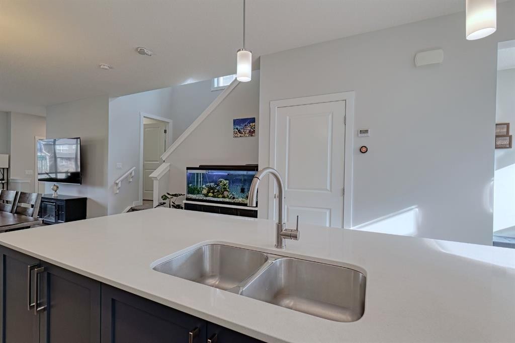 132 Wolf Willow Boulevard Se, Calgary, AB - Indoor Photo Showing Kitchen With Double Sink