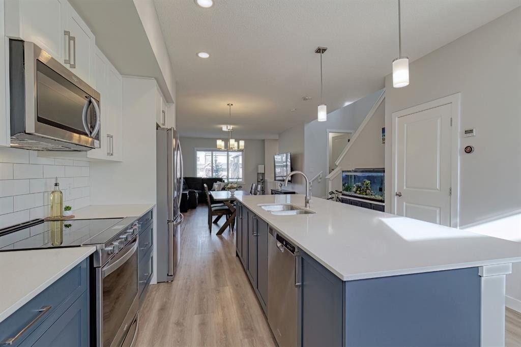 132 Wolf Willow Boulevard Se, Calgary, AB - Indoor Photo Showing Kitchen With Stainless Steel Kitchen With Upgraded Kitchen