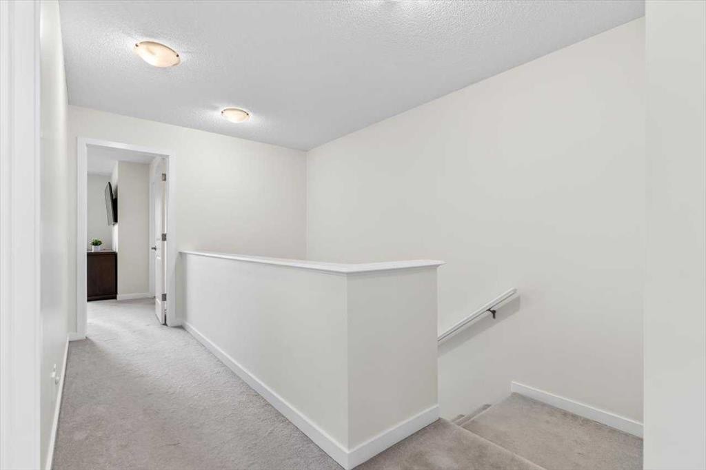 1303 New Brighton Park Se, Calgary, AB - Indoor Photo Showing Other Room