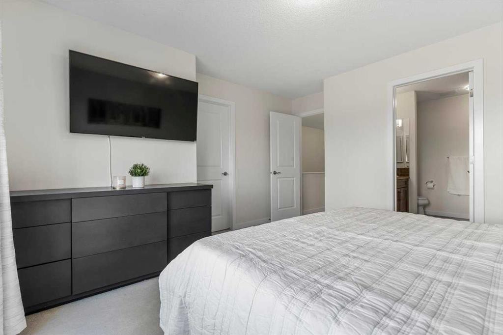 1303 New Brighton Park Se, Calgary, AB - Indoor Photo Showing Bedroom