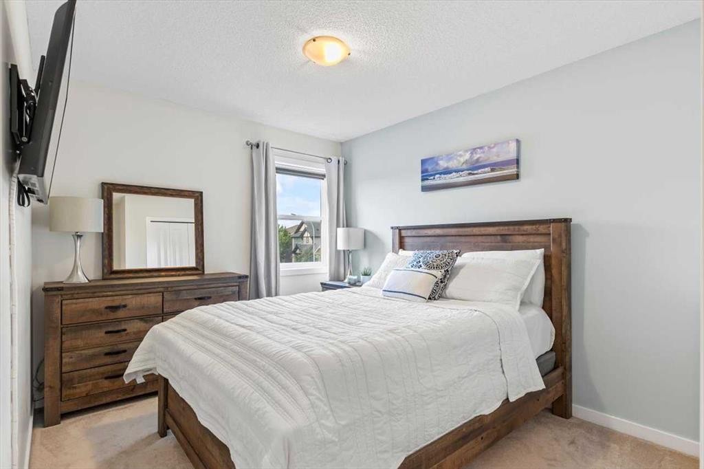 1303 New Brighton Park Se, Calgary, AB - Indoor Photo Showing Bedroom