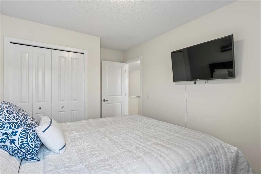 1303 New Brighton Park Se, Calgary, AB - Indoor Photo Showing Bedroom