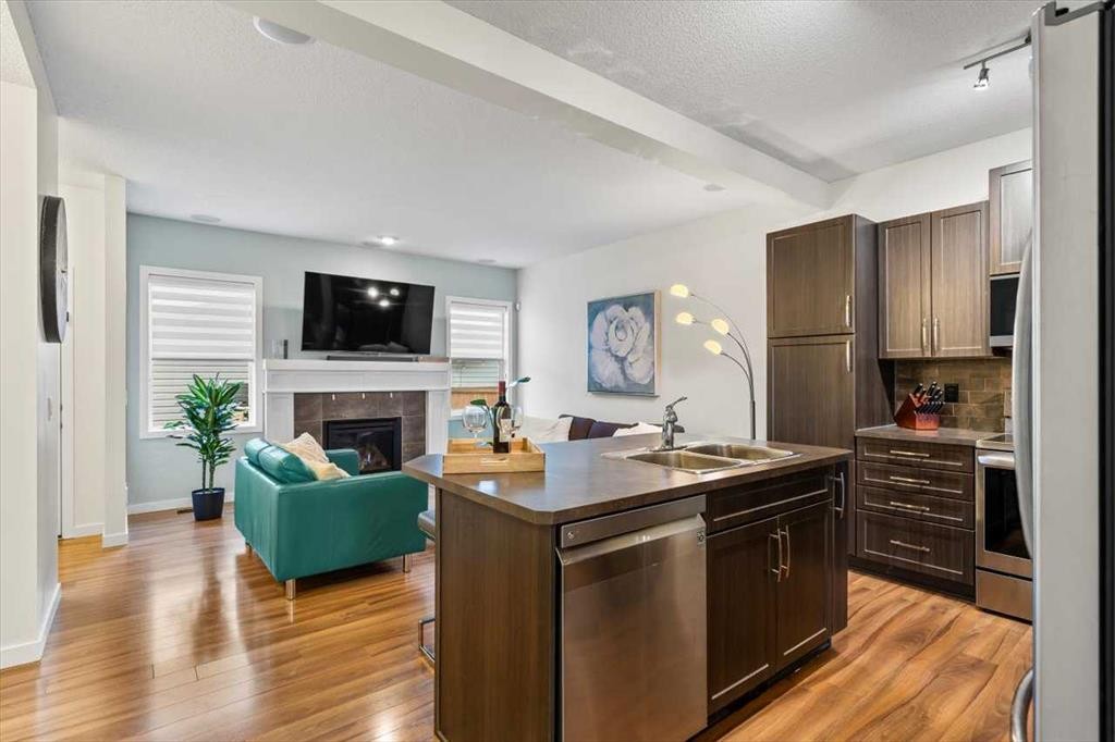 1303 New Brighton Park Se, Calgary, AB - Indoor Photo Showing Other Room With Fireplace