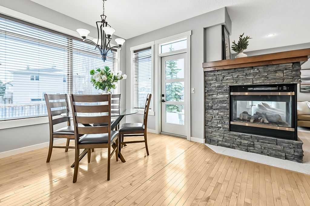 87 Chaparral Grove Se, Calgary, AB - Indoor Photo Showing Dining Room With Fireplace
