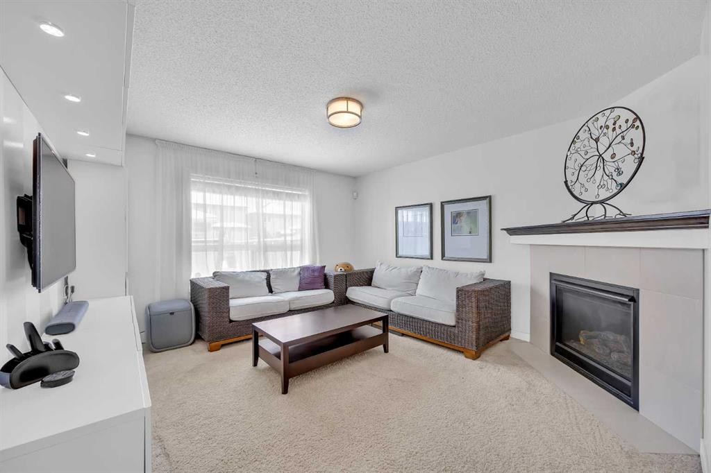 245 Skyview Ranch Way Ne, Calgary, AB - Indoor Photo Showing Living Room With Fireplace